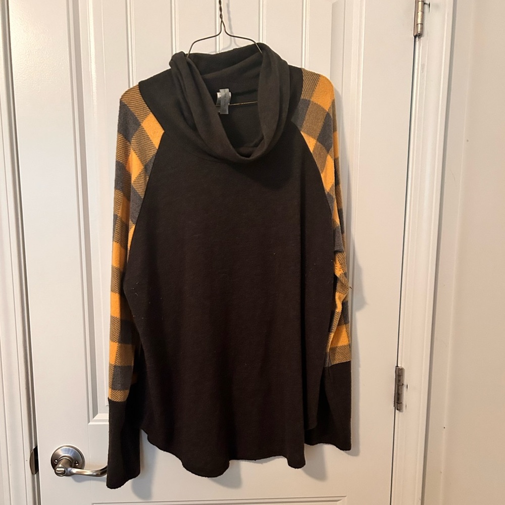 Dark gray with mustard on the sleeve with a swoop neck size 3X